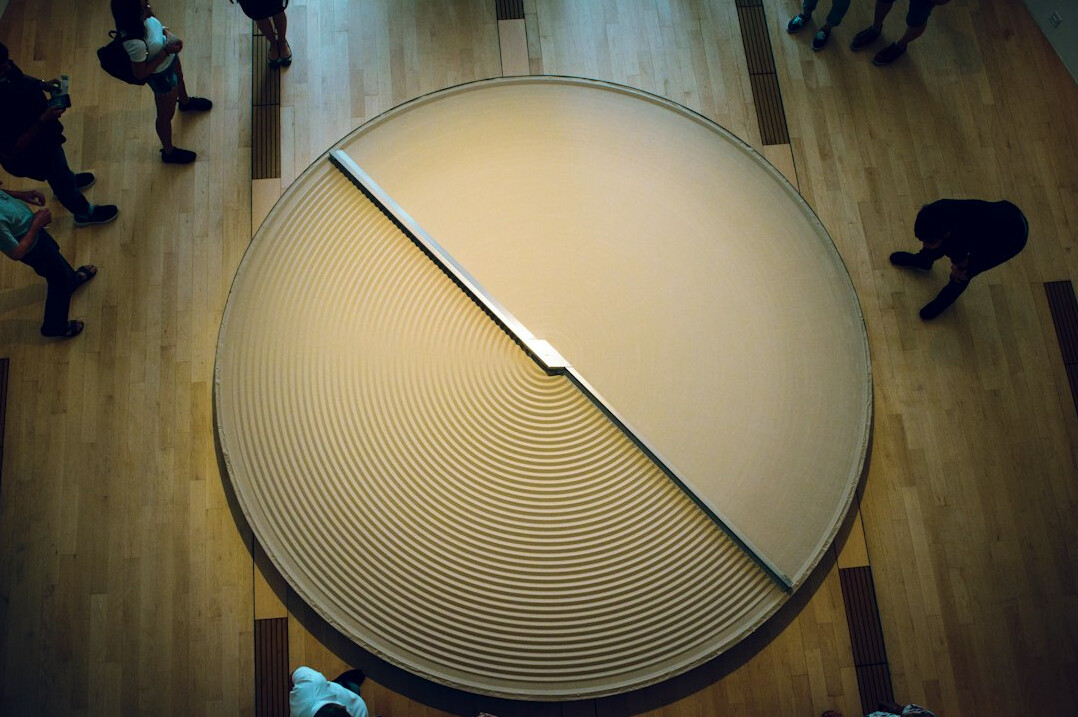Conference table with people discussing research