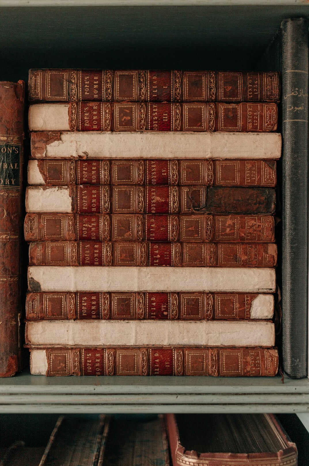 Stack of old leather-bound books