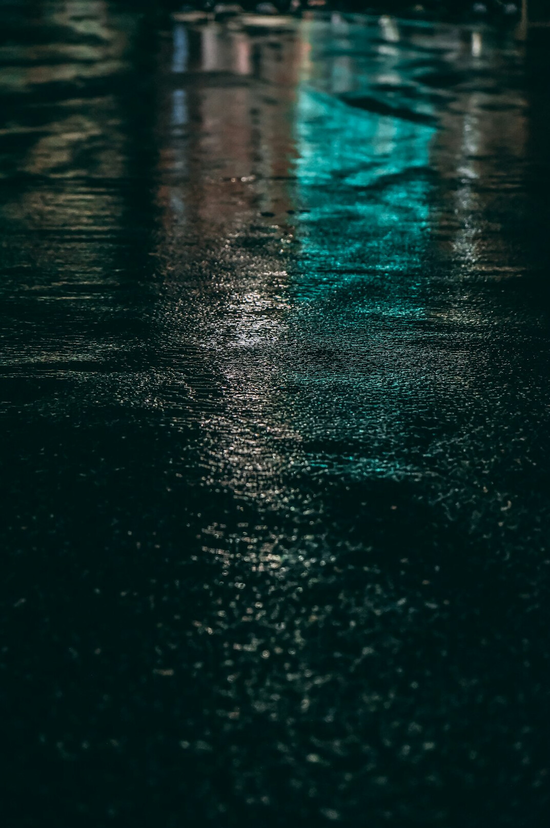 Wet city street in the evening with reflections