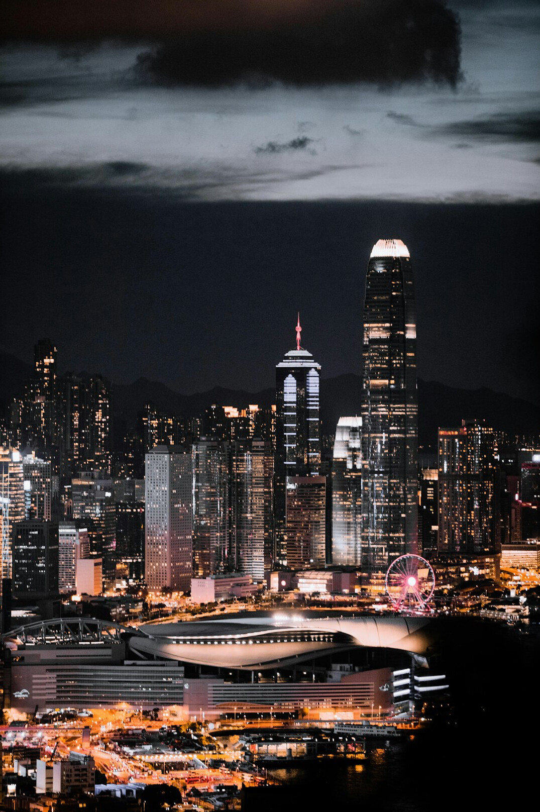 City skyline at night with illuminated buildings
